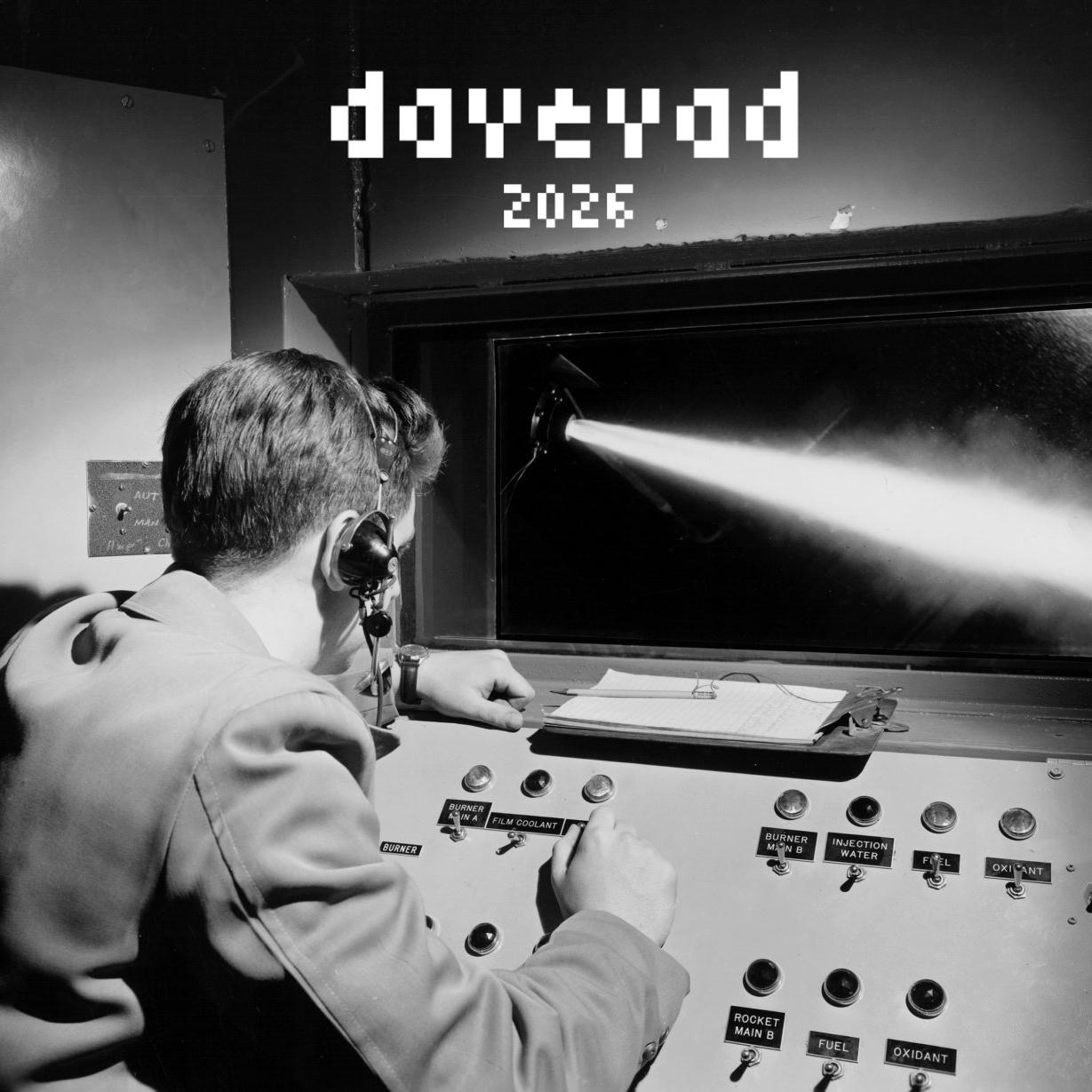 1950's public domain photograph of a military employee sitting at a rocket control panel.